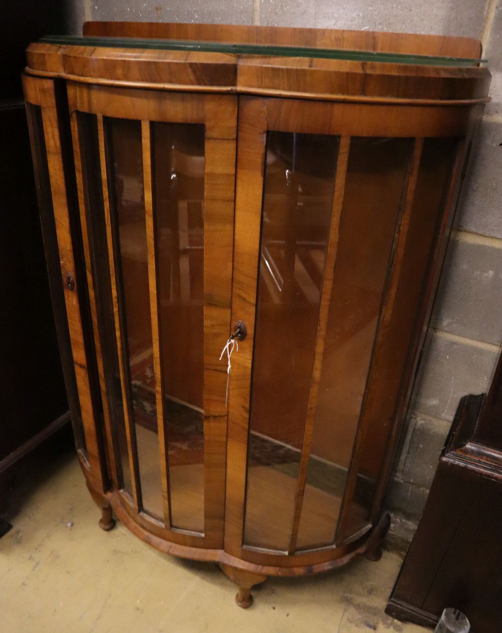 A walnut bowfront display cabinet, width 92cm depth 40cm height 124cm